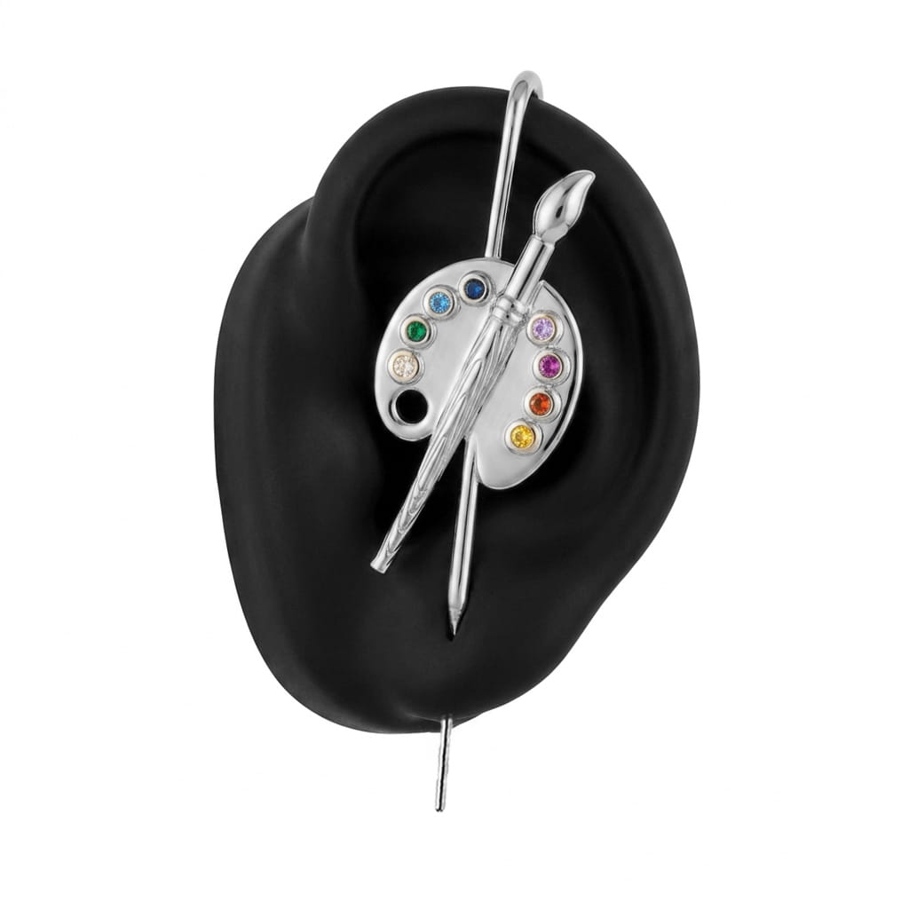 Artist ear cuff in silver on a black ear form