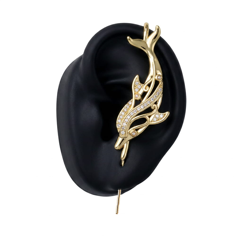 Graceful Dolphin ear cuff in gold on a black ear form