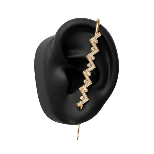 Traces ear cuff in gold on a black ear form