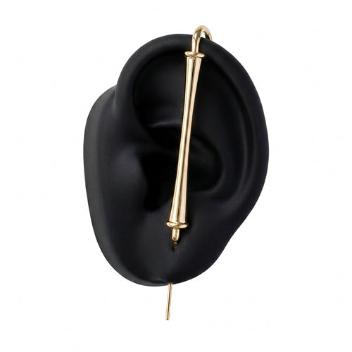Pillar of Fortitude ear cuff in gold on a black ear form