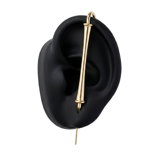 Pillar of Fortitude ear cuff in gold on a black ear form