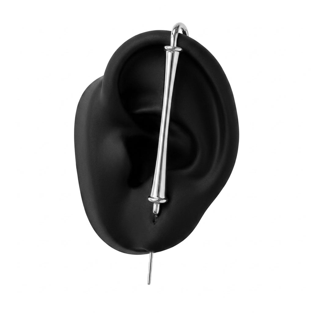 Pillar of Fortitude ear cuff in silver on a black ear form