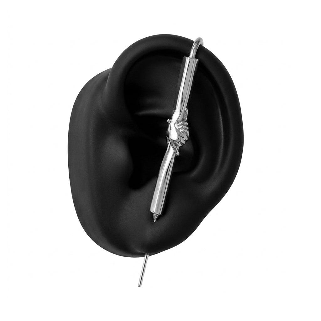 Helping Hand ear cuff in silver on a black ear form