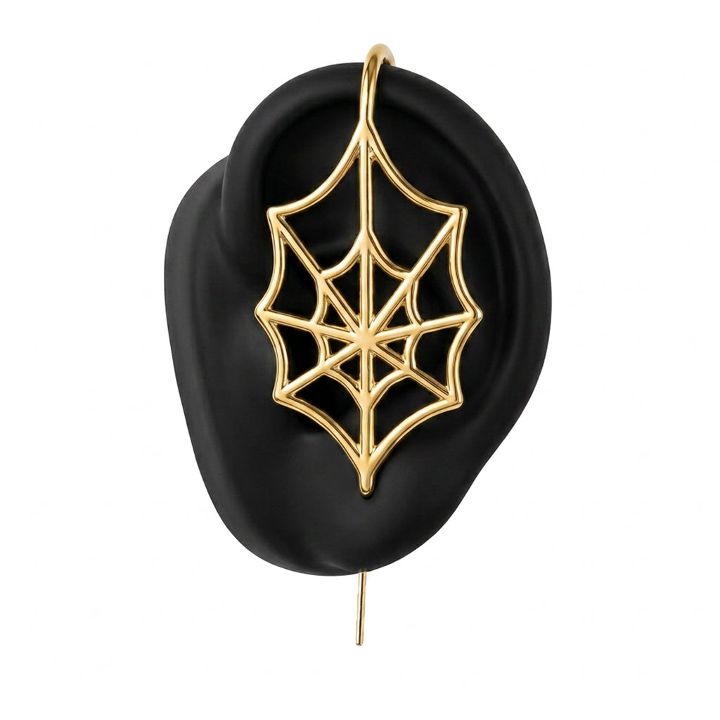 Silky Web ear cuff in gold on a black ear form