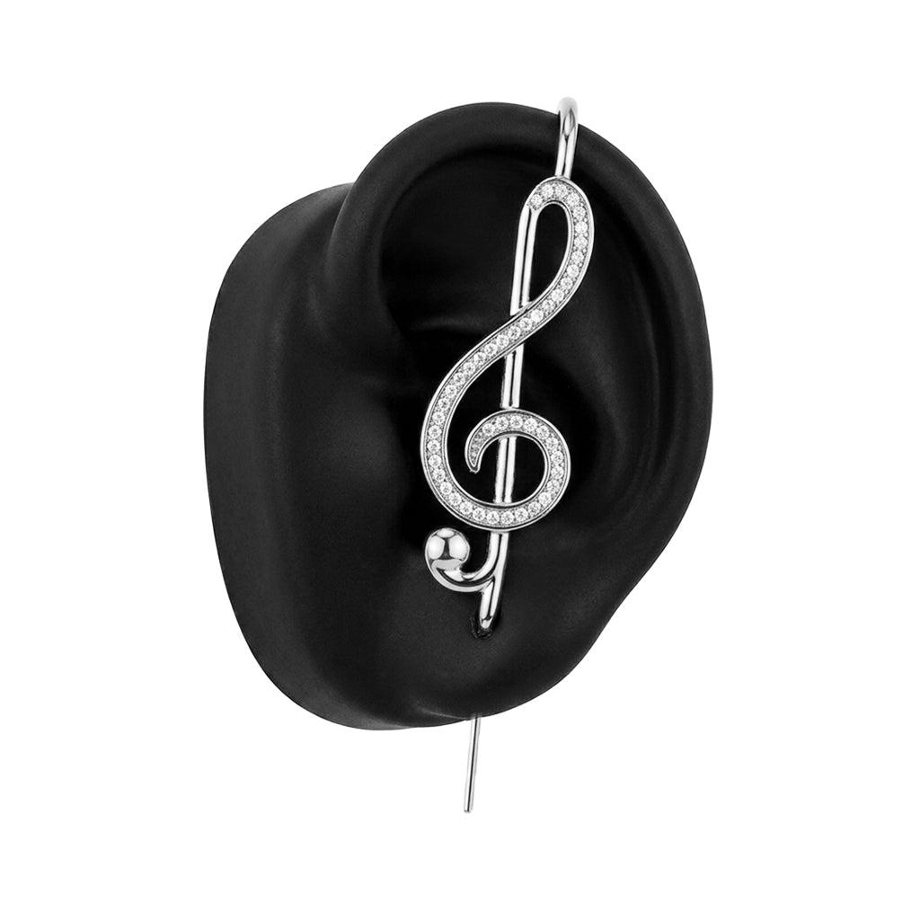 Treble Clef ear cuff in silver on a black ear form