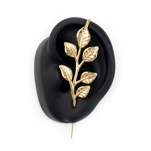 Whispering Leaves ear cuff in gold on a black ear form