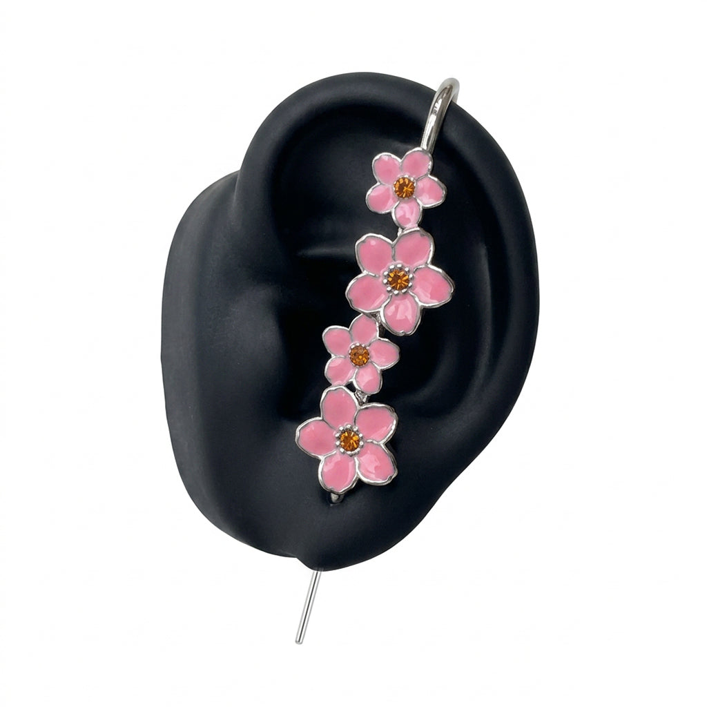 Cherry Blossom ear cuff in silver on a black ear form