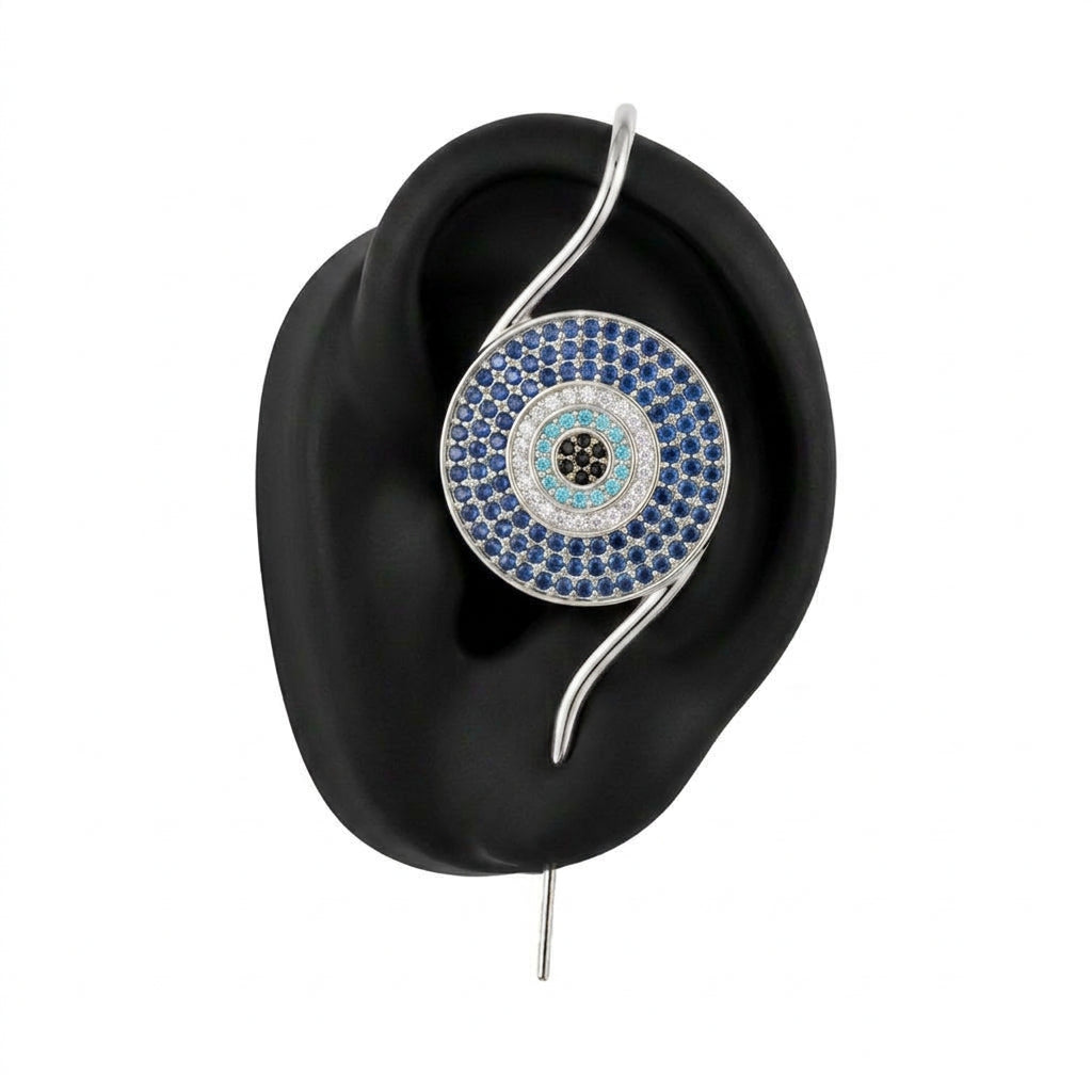 Evil Eye ear cuff in silver on a black ear form