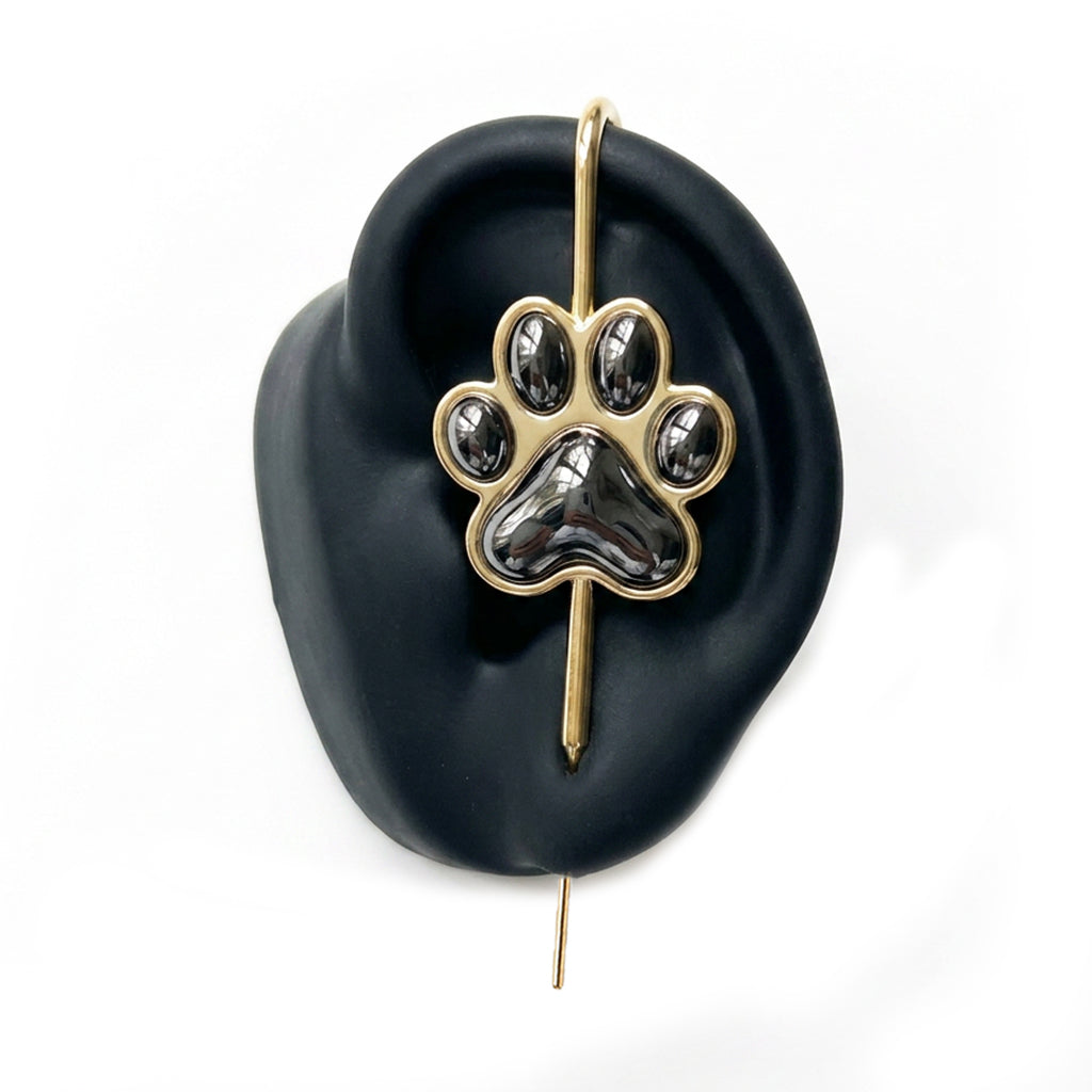 Pawfect ear cuff in gold on a black ear form