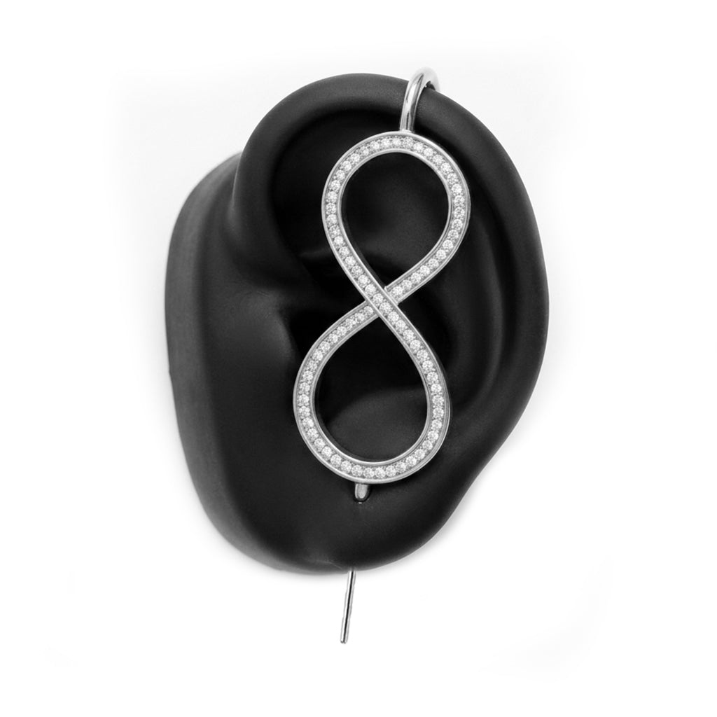 Infinity ear cuff in silver on a black ear form