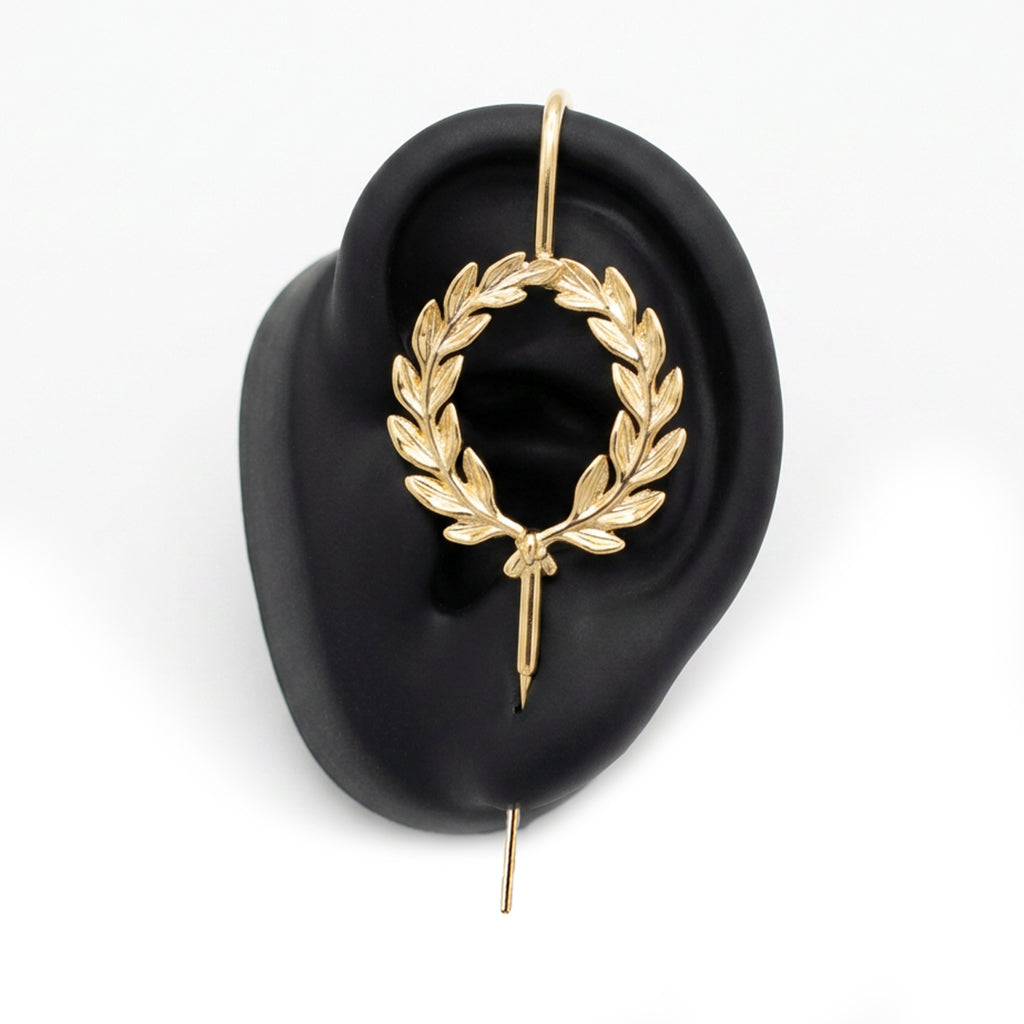 Regel Laurel ear cuff in gold on a black ear form
