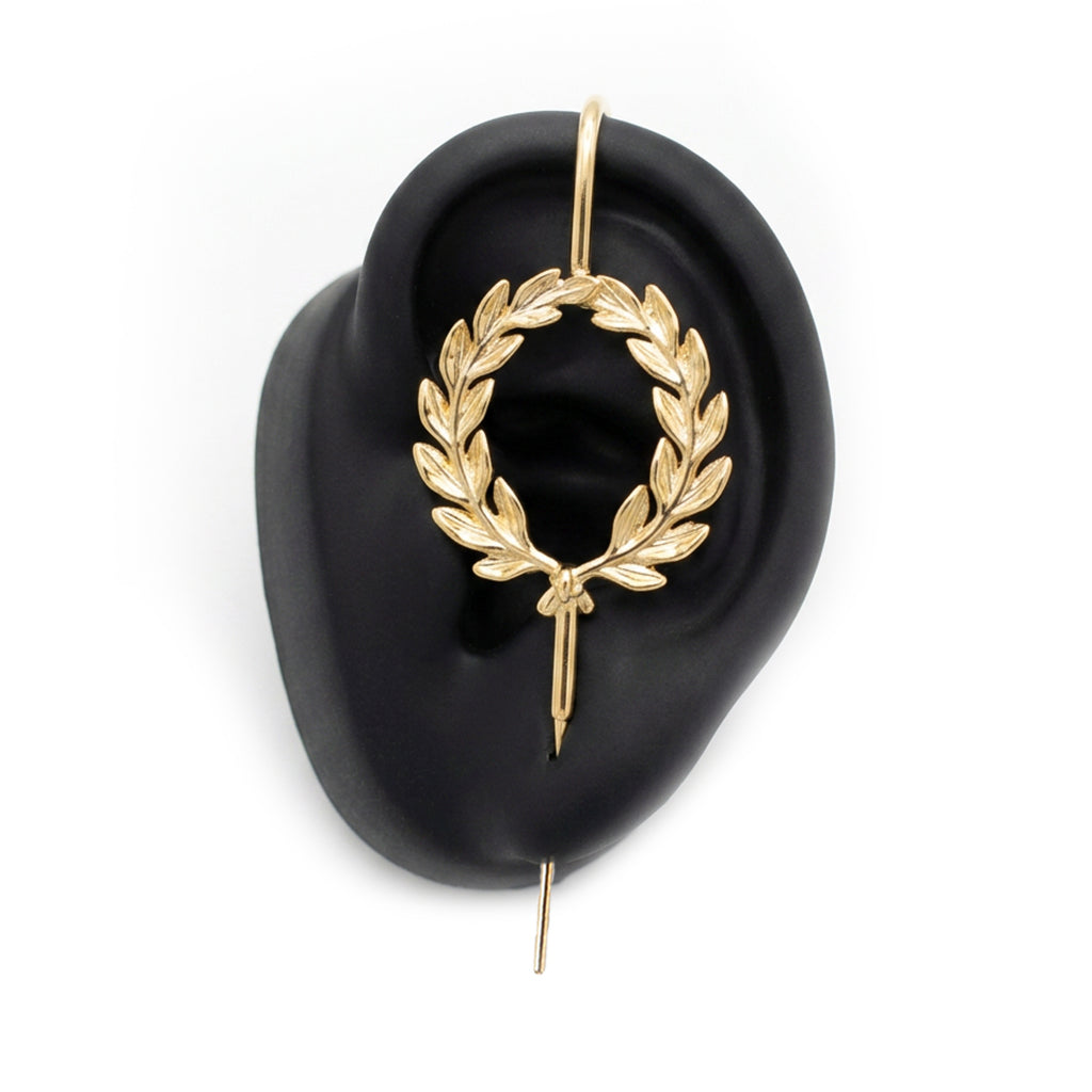 Regel Laurel ear cuff in gold on a black ear form
