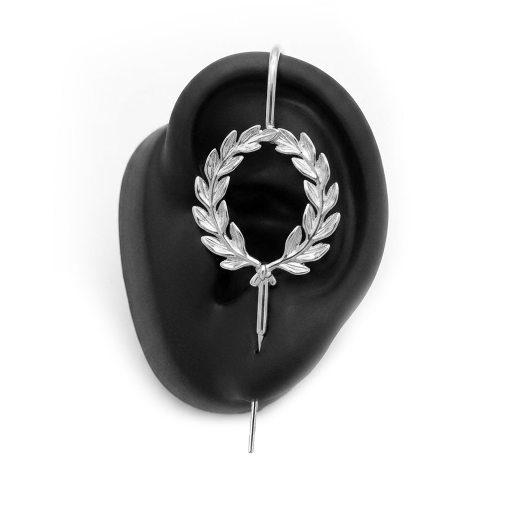 Regel Laurel ear cuff in silver on a black ear form