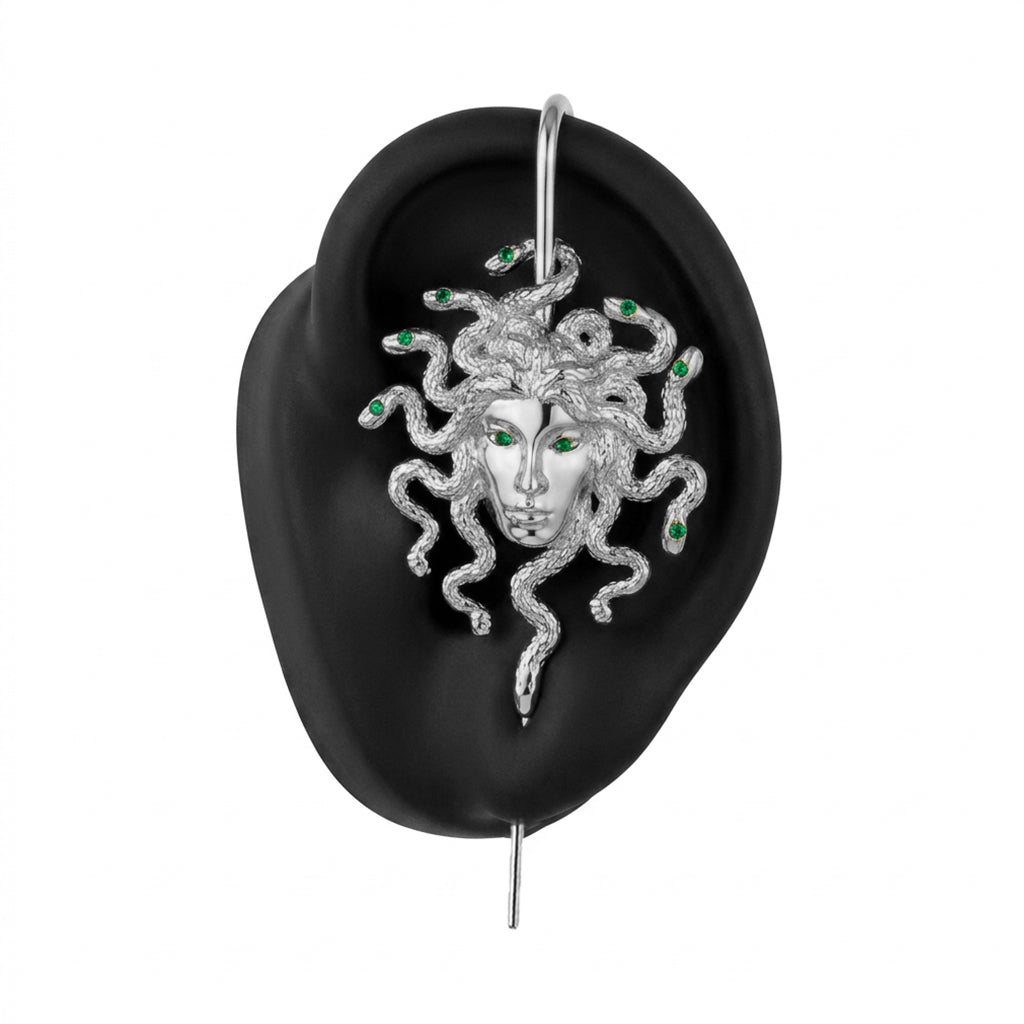 Medusa's Gaze ear cuff in silver on a black ear form