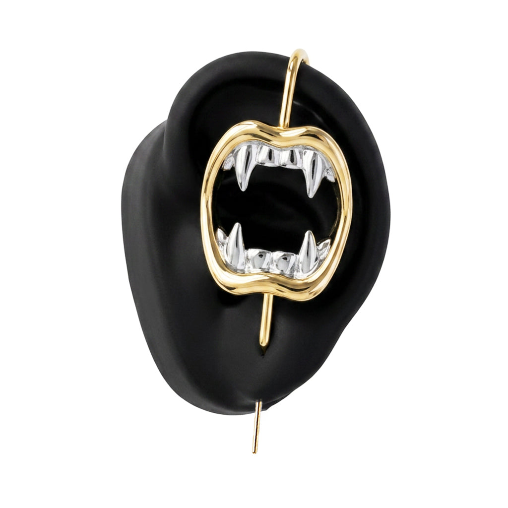 Vampire Fangs ear cuff in gold on a black ear form