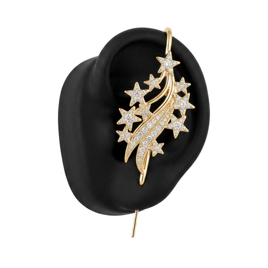 Starfall ear cuff in gold on a black ear form