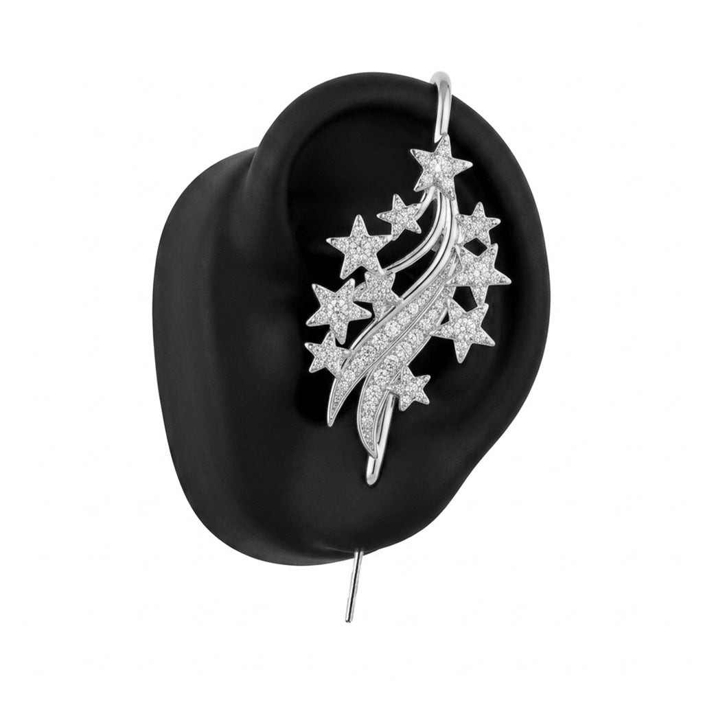 Starfall ear cuff in silver on a black ear form