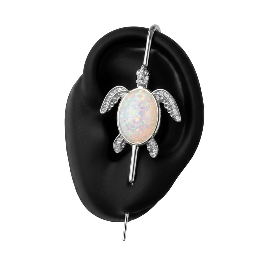 Ocean Guardian ear cuff in silver on a black ear form
