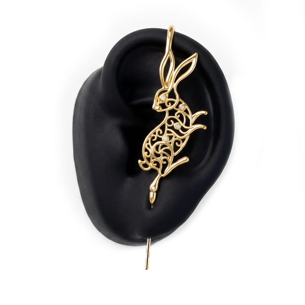 Leaping Hare ear cuff in gold on a black ear form