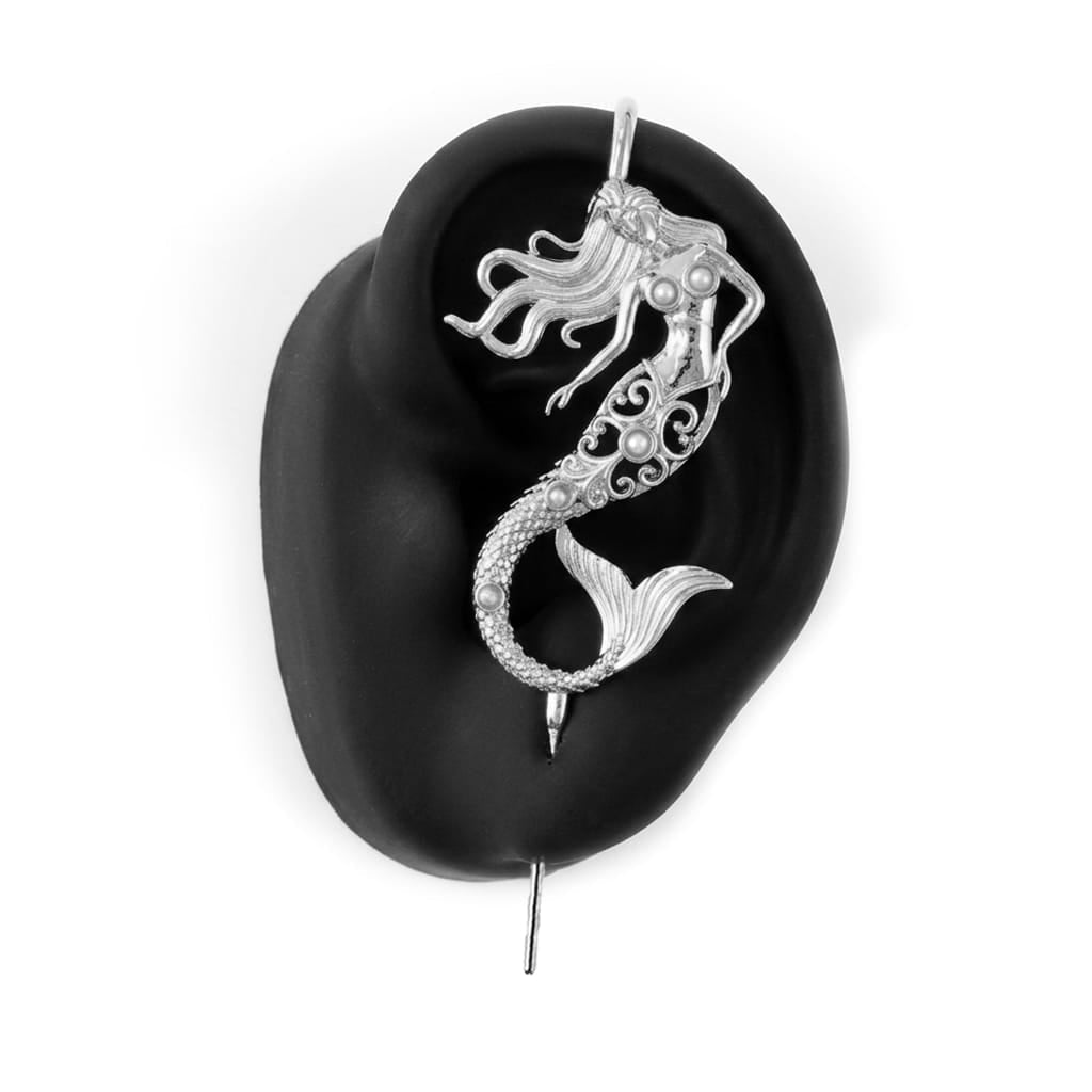 Ocean Siren ear cuff in silver on a black ear form