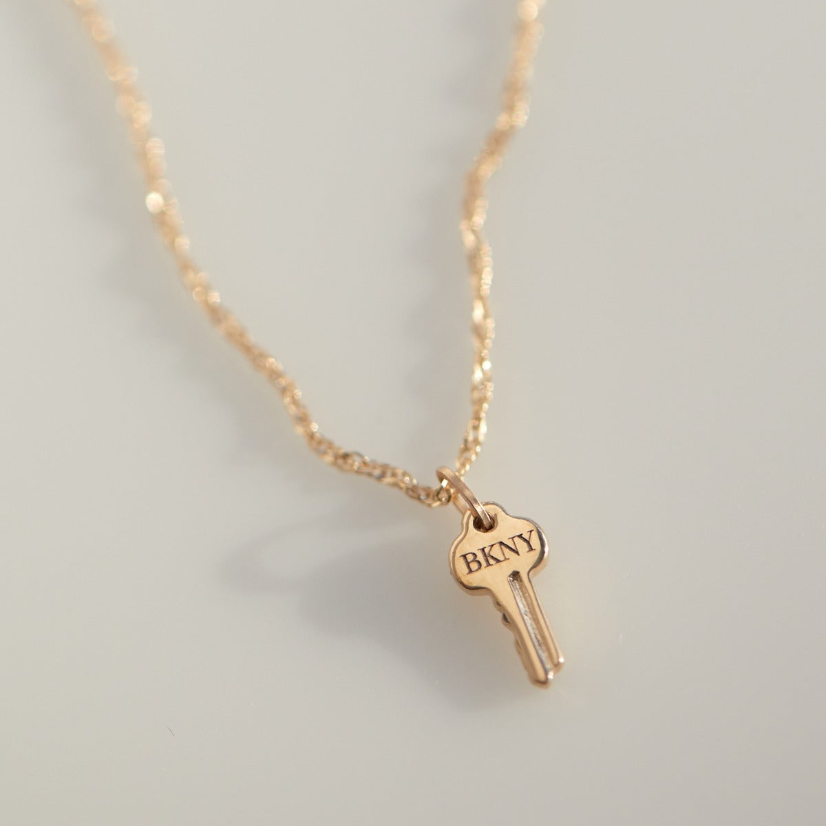 Avaline Tiniest Gold Key Charm