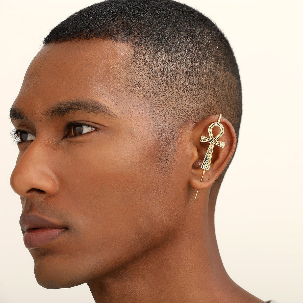 Ankh ear cuff worn on the ear, profile view