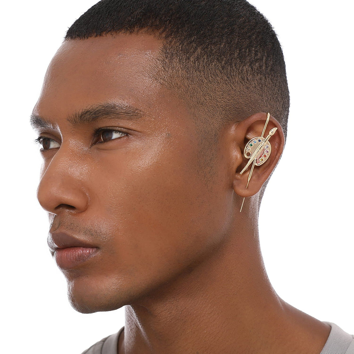 Artist ear cuff worn on the ear, profile view
