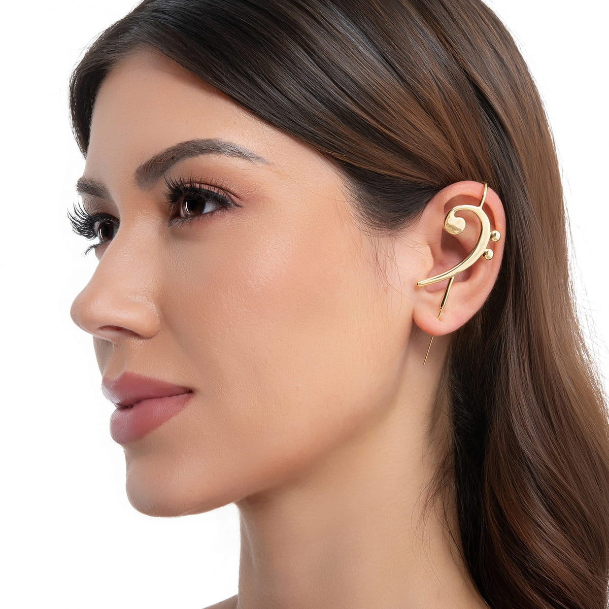 Bass Clef ear cuff in gold on a black ear form