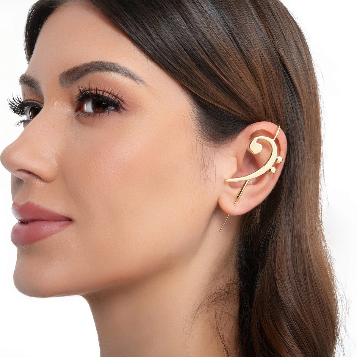 Bass Clef ear cuff in gold on a black ear form