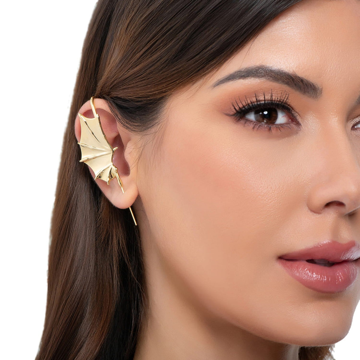 Nightfall Wings ear cuff in gold on a black ear form