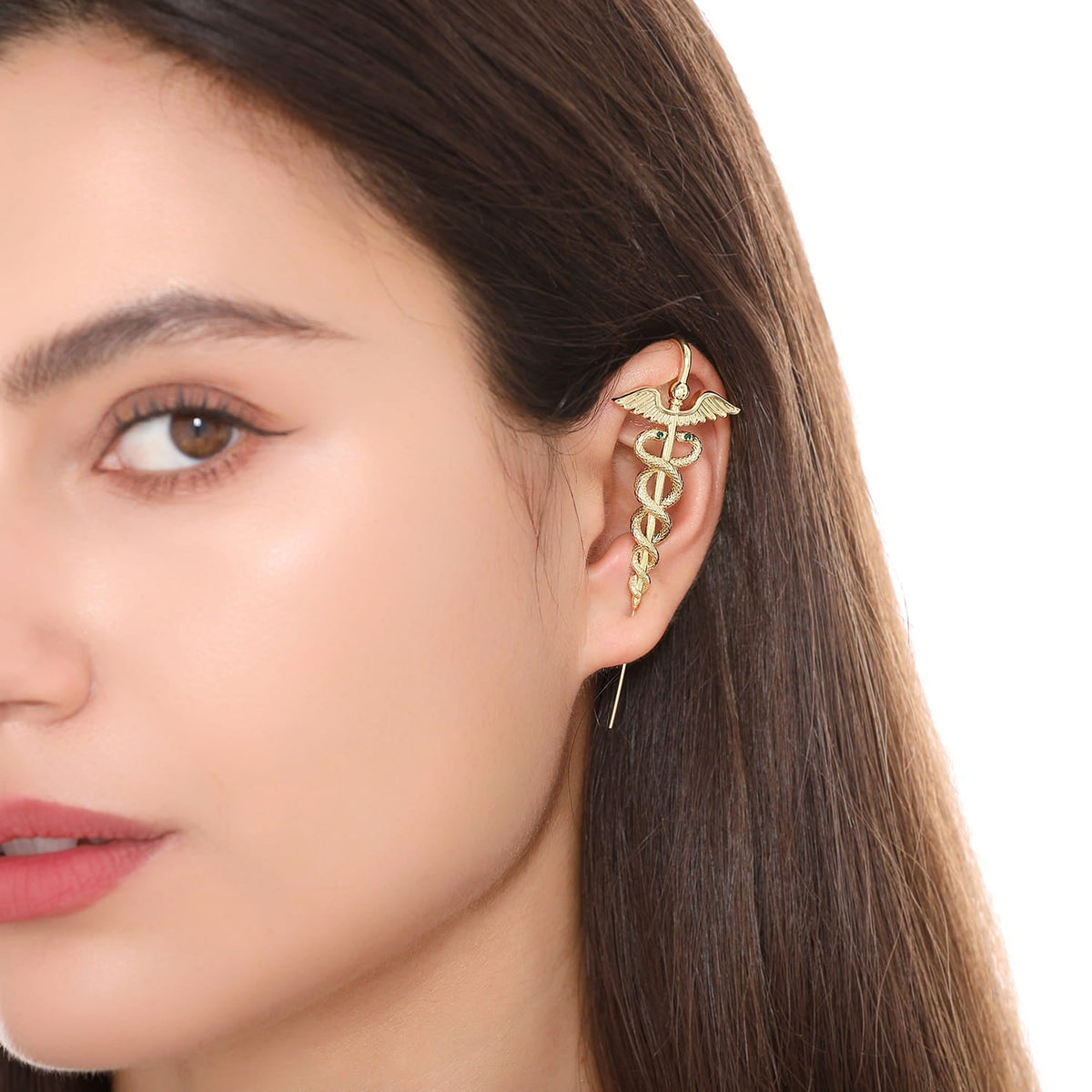 Caduceus ear cuff worn on the ear, profile view