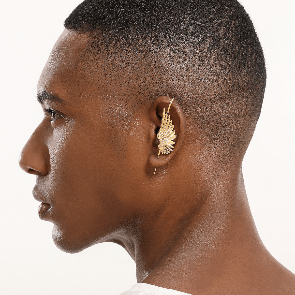 Celestial Wing ear cuff in gold worn on the ear, profile view