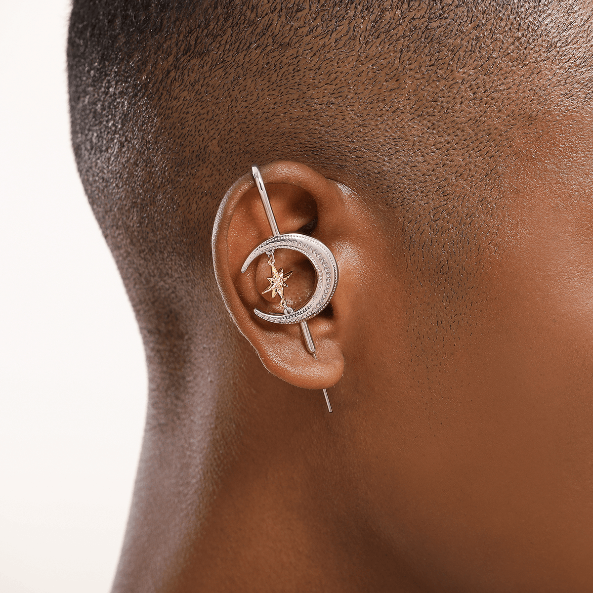 Cosmic Connection ear cuff in silver worn on the ear, profile view
