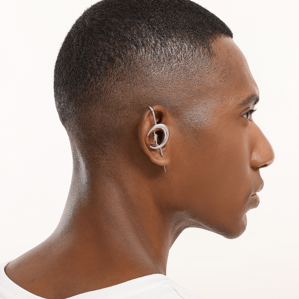 Cosmic Connection ear cuff in silver worn on the ear, profile view
