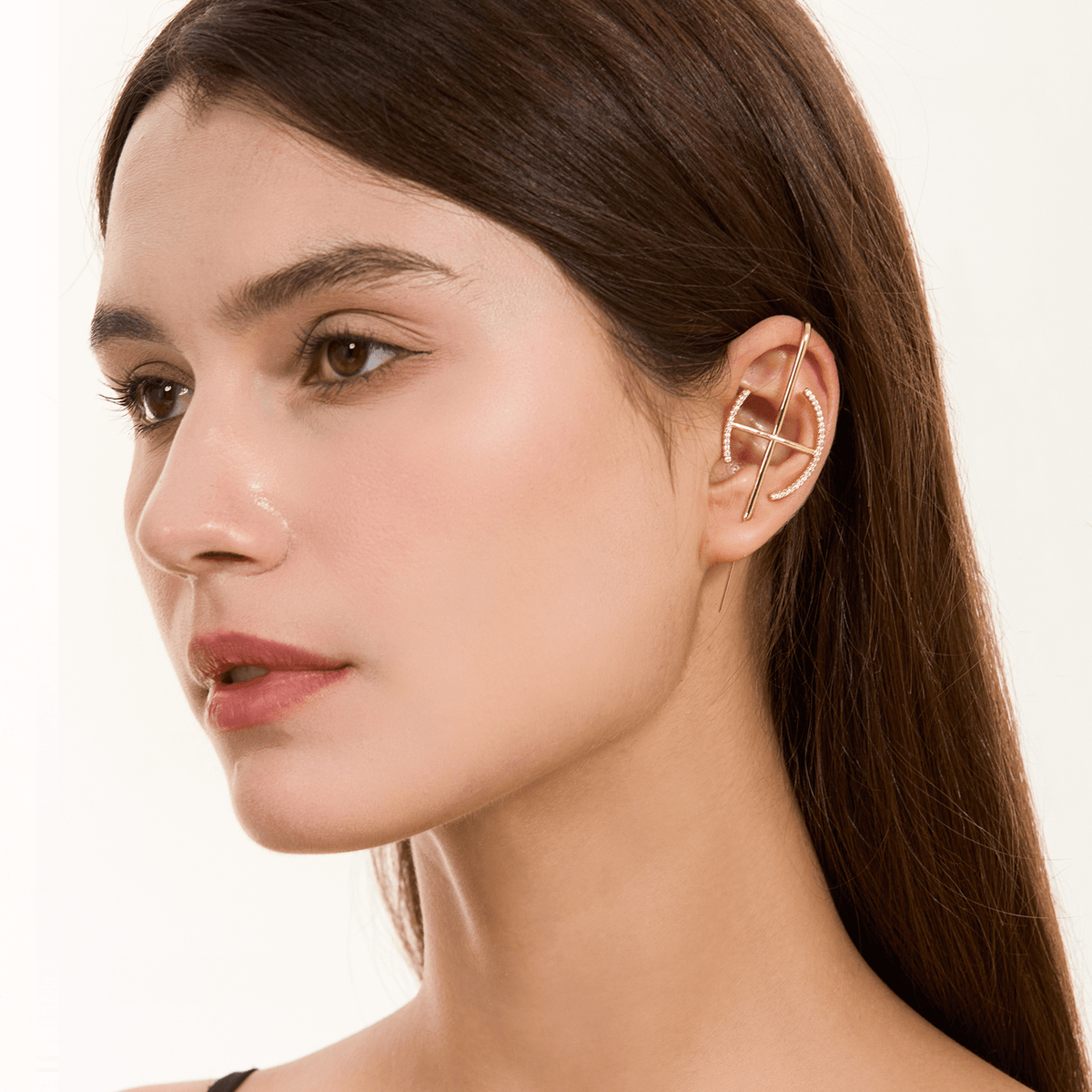 Elevate ear cuff in gold worn on the ear, profile view