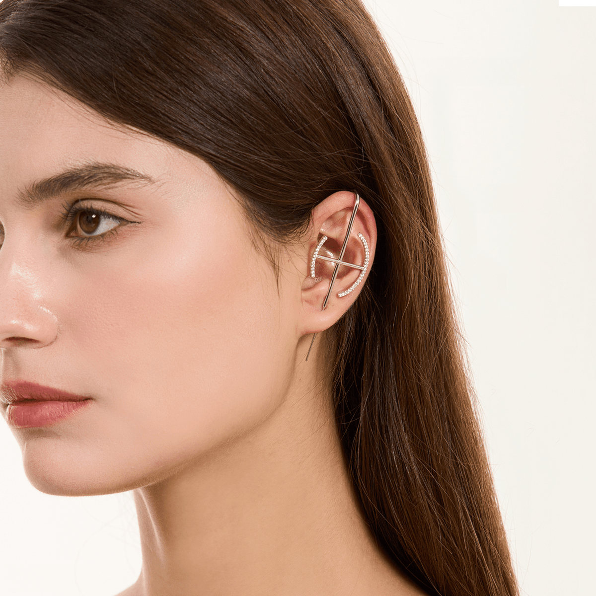 Elevate ear cuff in silver worn on the ear, profile view