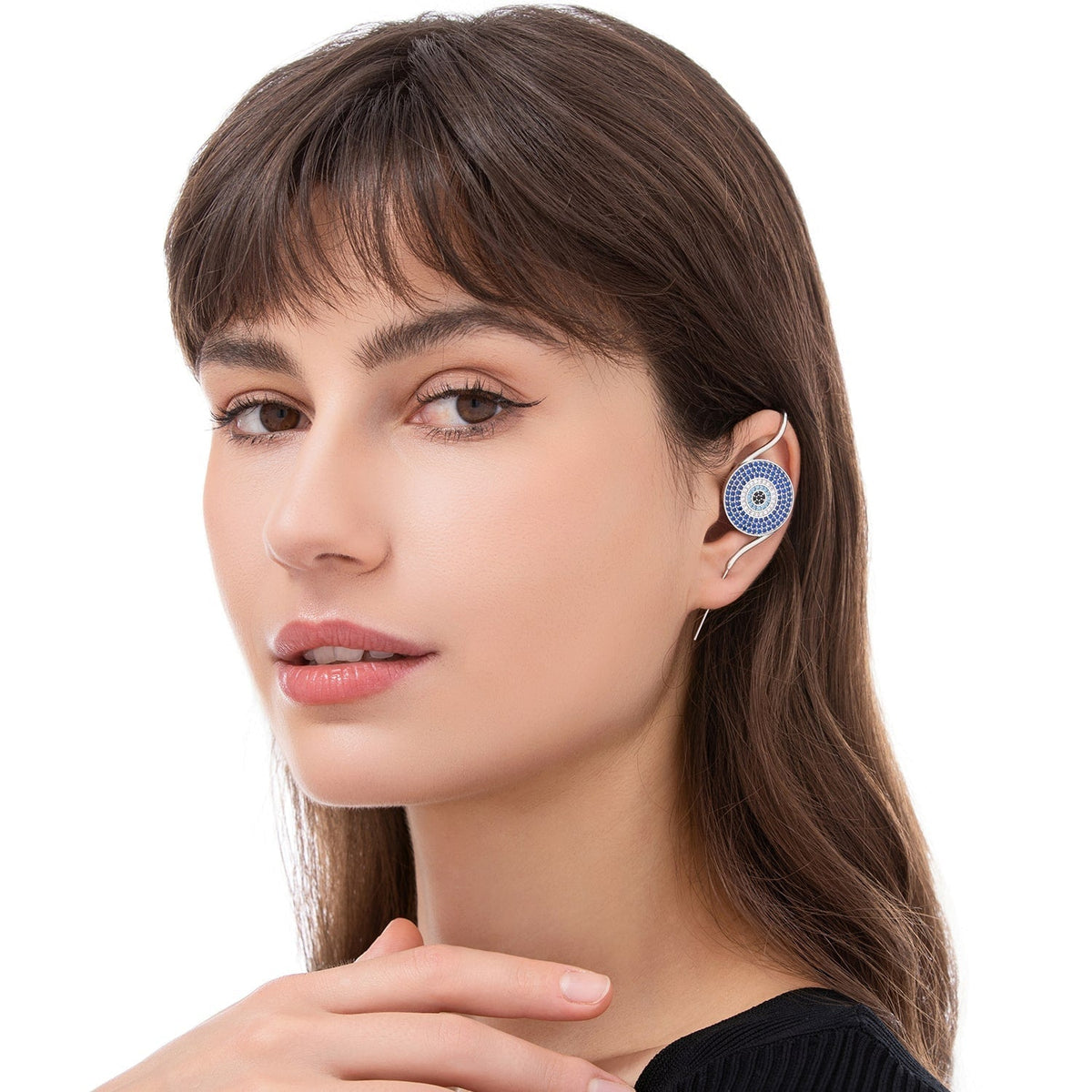 Evil Eye ear cuff worn on the ear, profile view