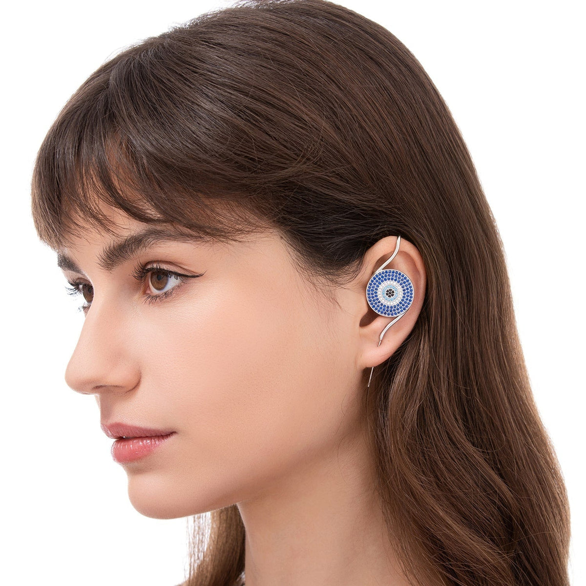 Evil Eye ear cuff worn on the ear, profile view