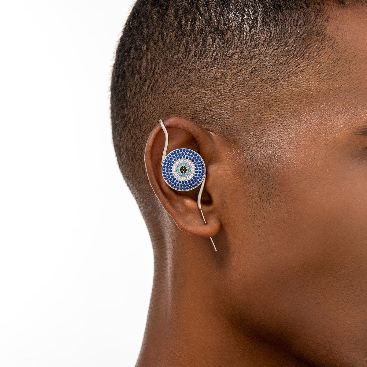 Evil Eye ear cuff worn on the ear, profile view