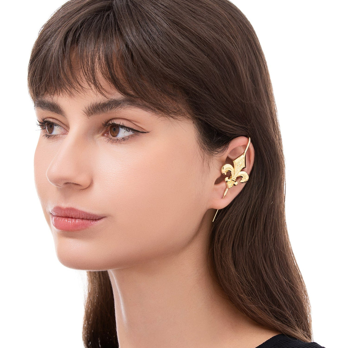 Fleur De Lys ear cuff worn on the ear, profile view