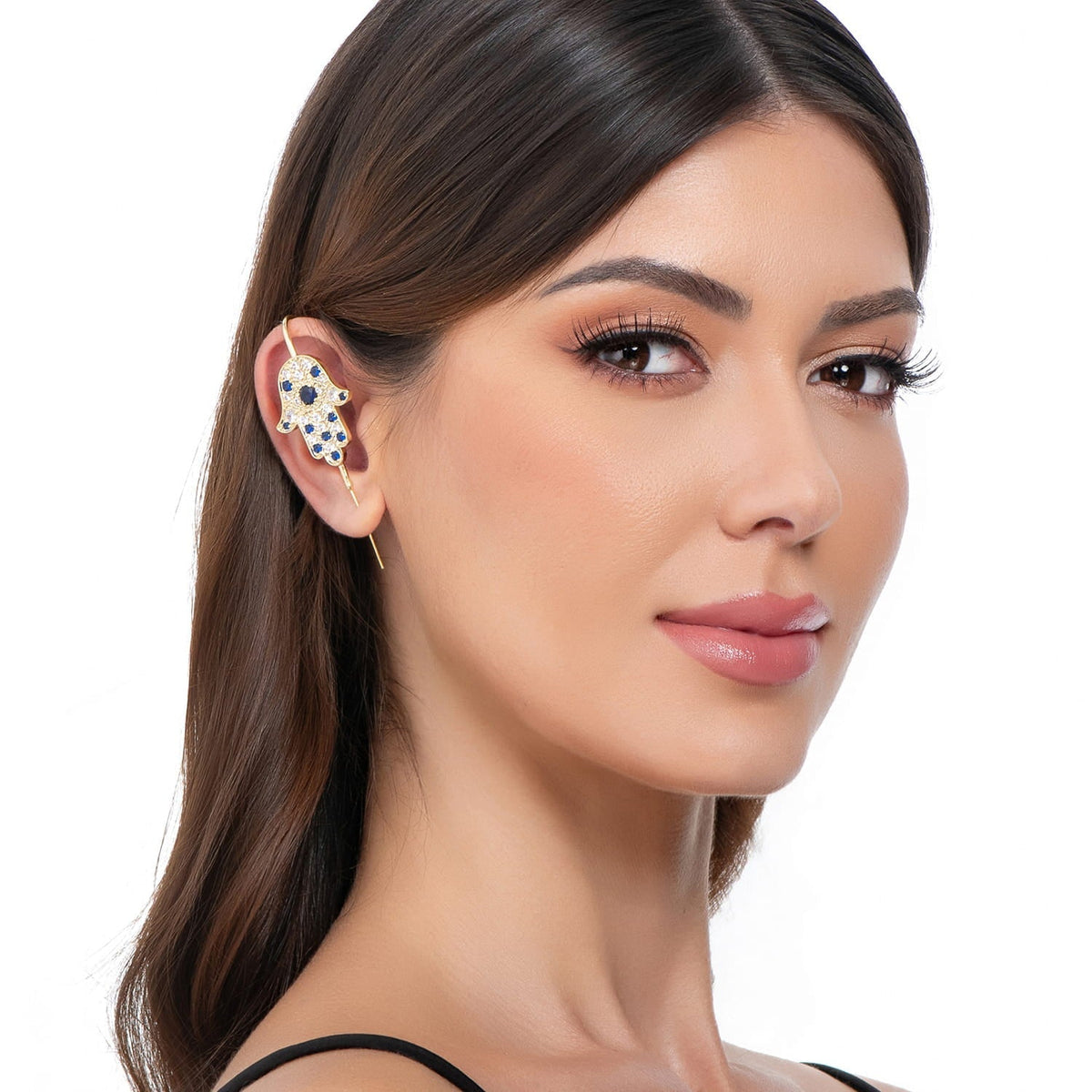 Hamsa ear cuff in gold on a black ear form