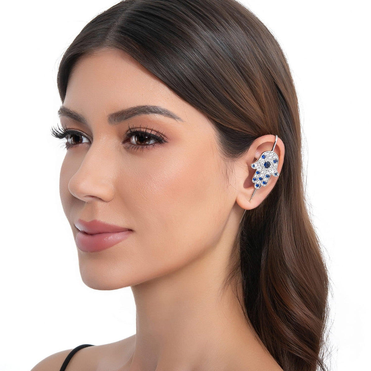 Hamsa ear cuff in silver on a black ear form