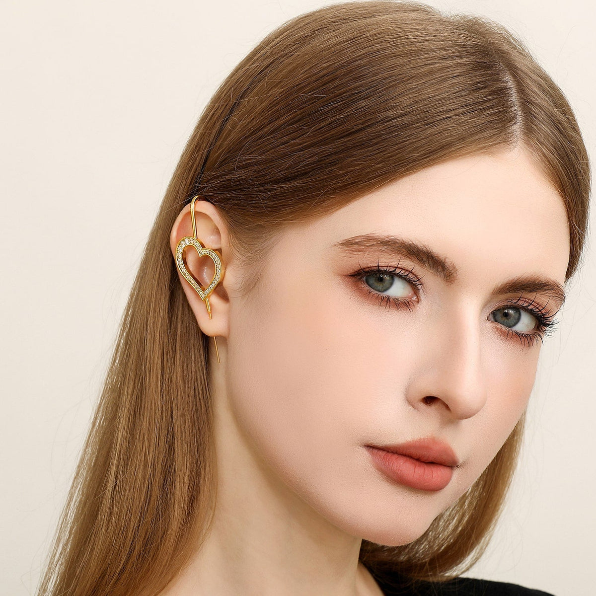 Pure Heart ear cuff worn on the ear, profile view