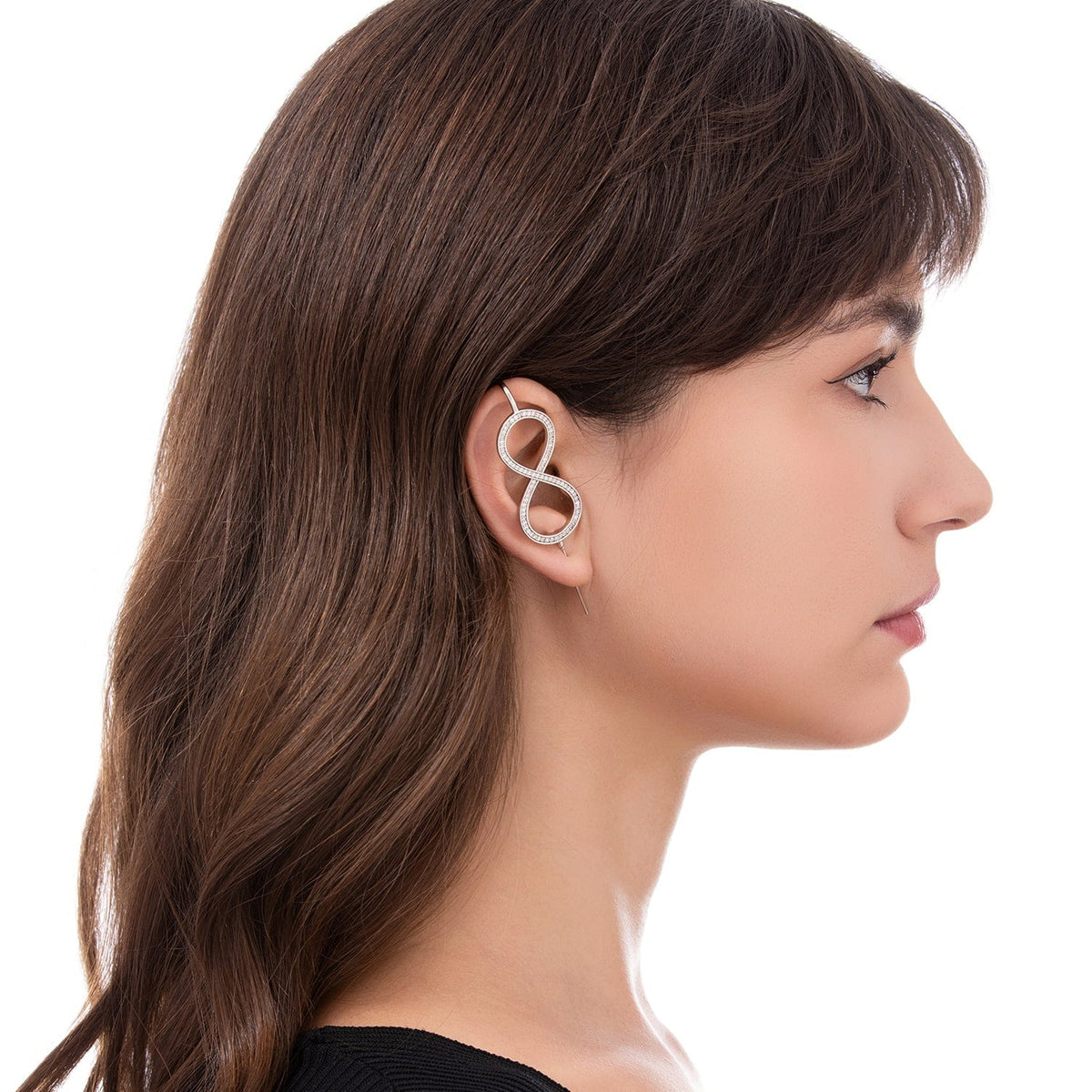 Infinity ear cuff worn on the ear, profile view