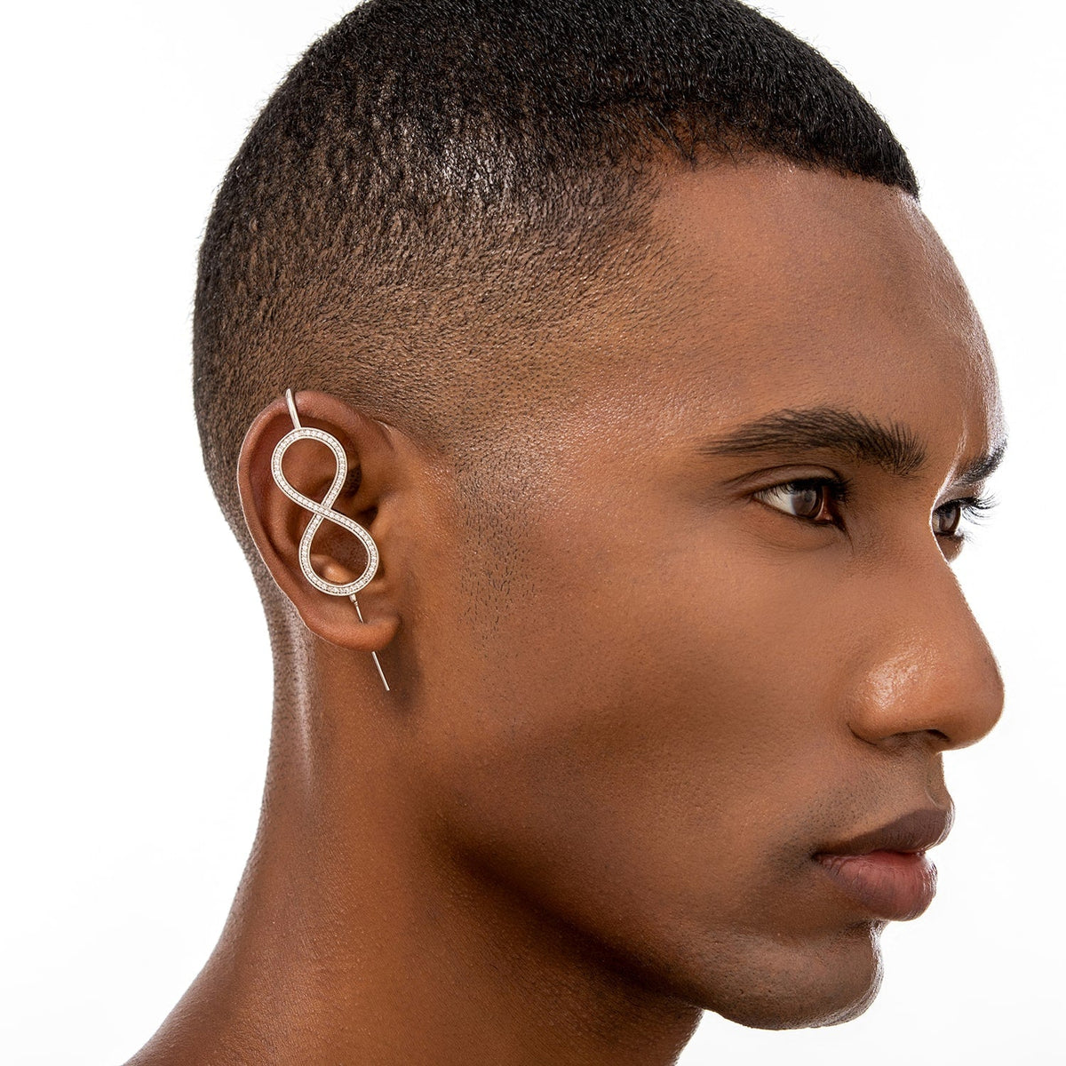Infinity ear cuff worn on the ear, profile view