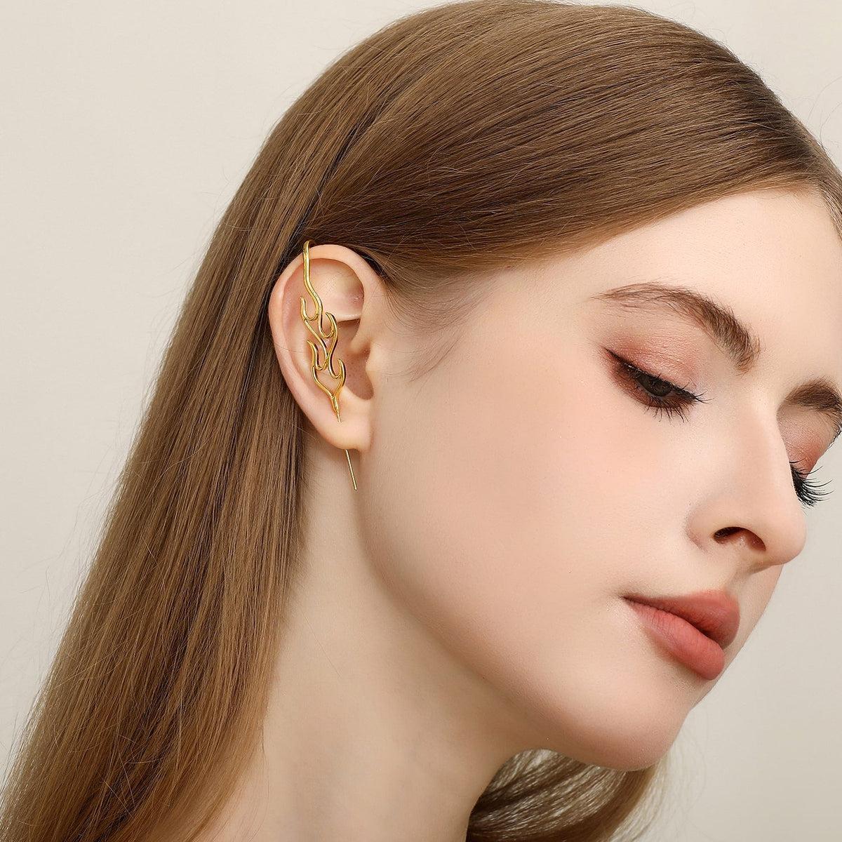 Inner Fire ear cuff worn on the ear, profile view