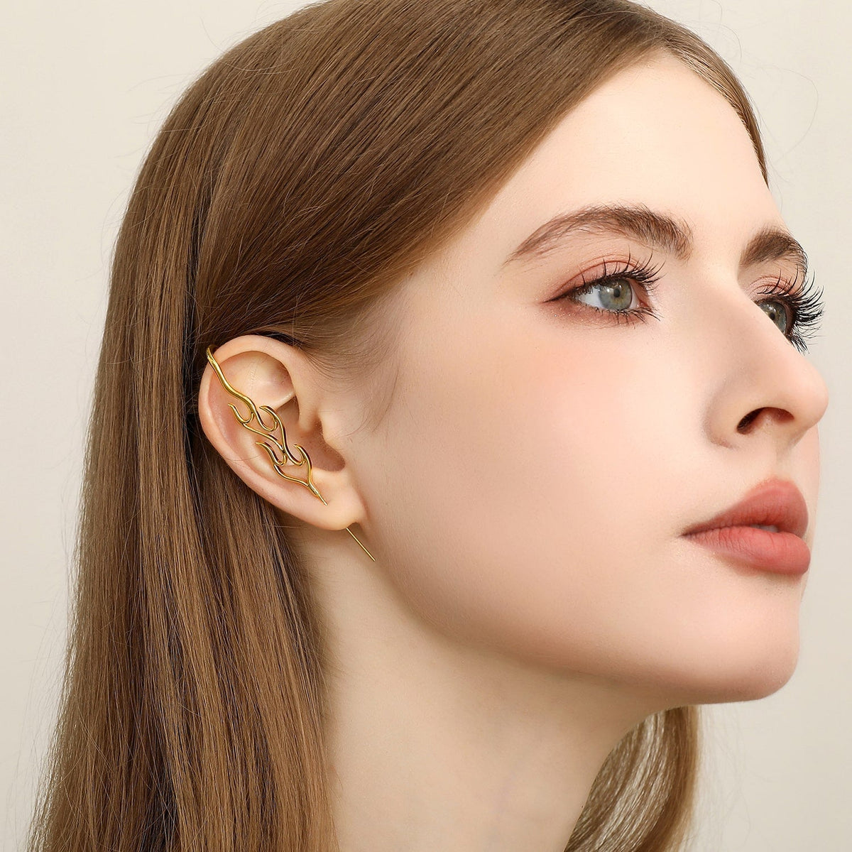 Inner Fire ear cuff worn on the ear, profile view