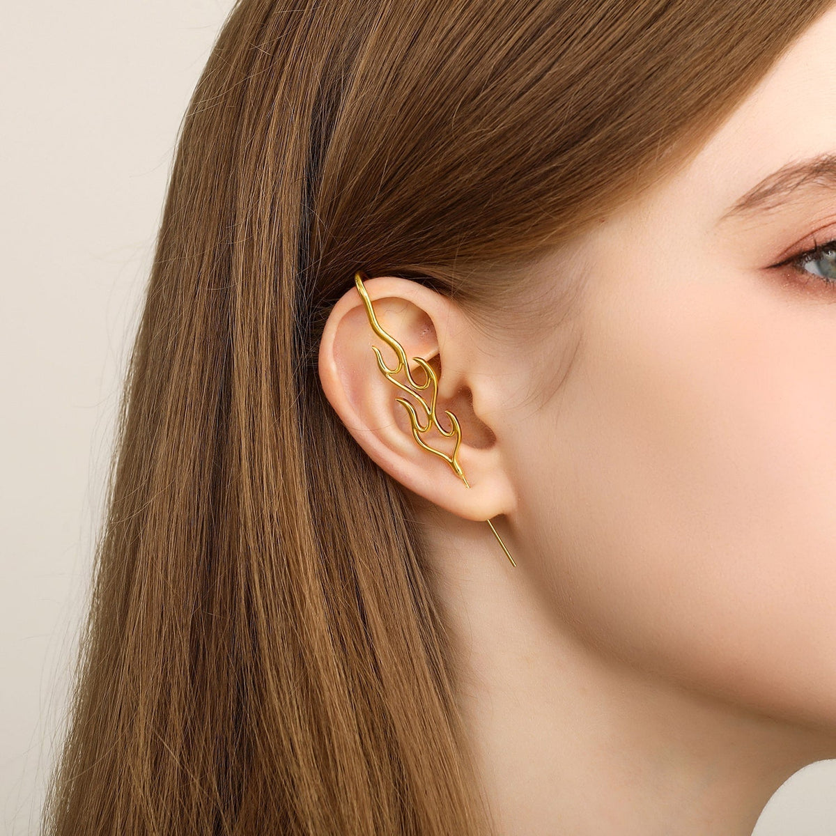 Inner Fire ear cuff worn on the ear, profile view