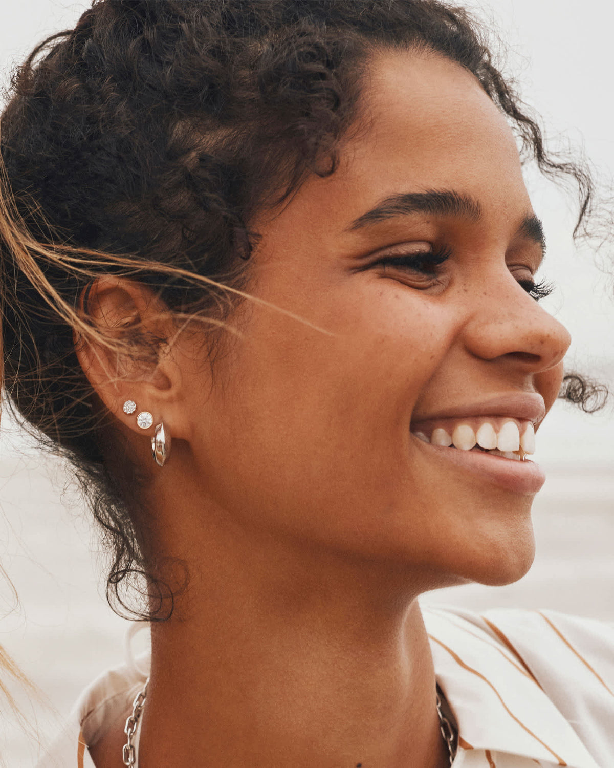 Avaline Mikki Metal Huggie Earrings in Gold