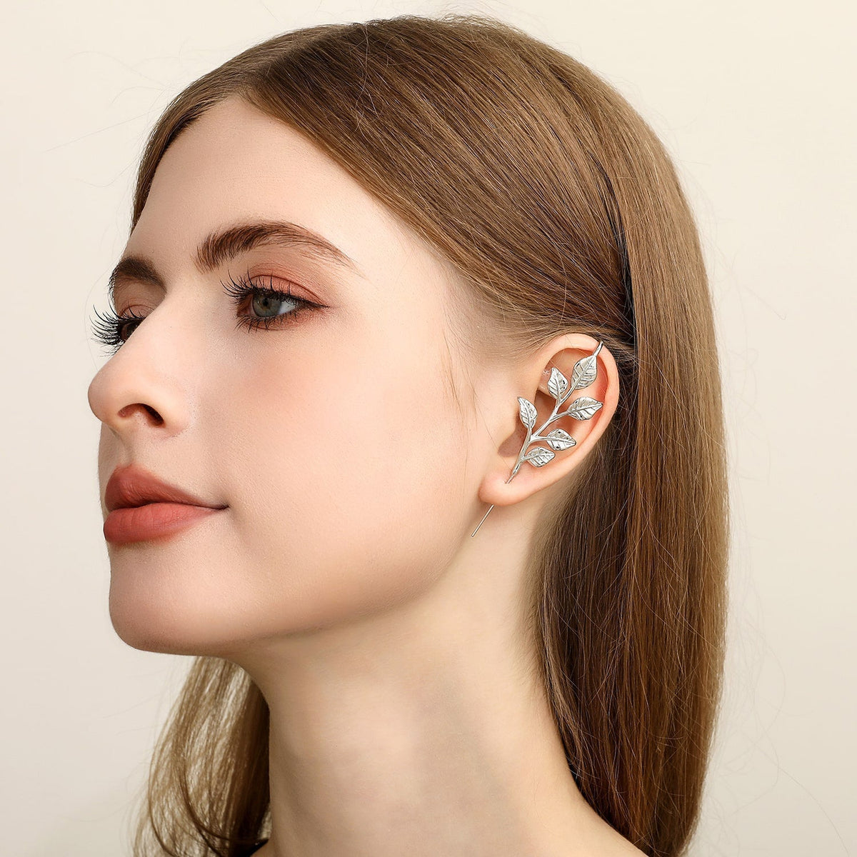 Whispering Leaves ear cuff worn on the ear, profile view